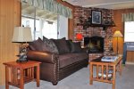 Comfortable Living Room with Brick Fireplace
